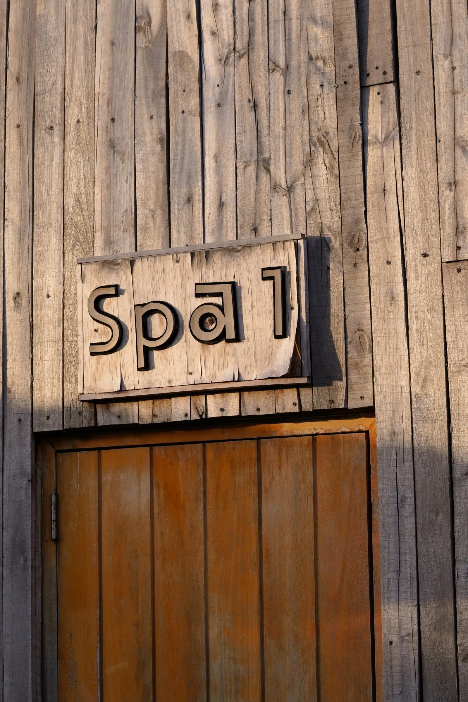 Spa sign on a timber wall