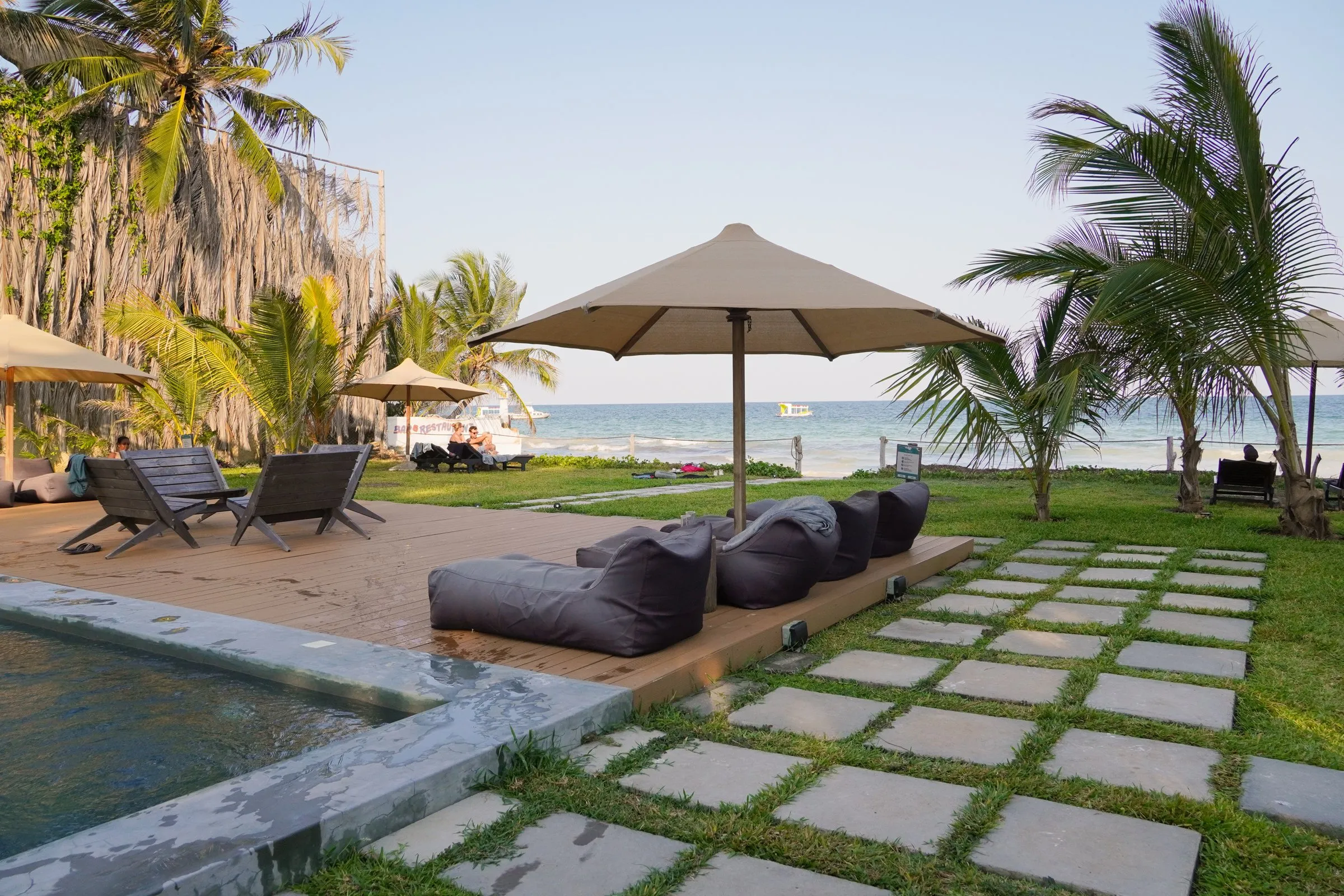 The pool, an umbrella and the Indian Ocean