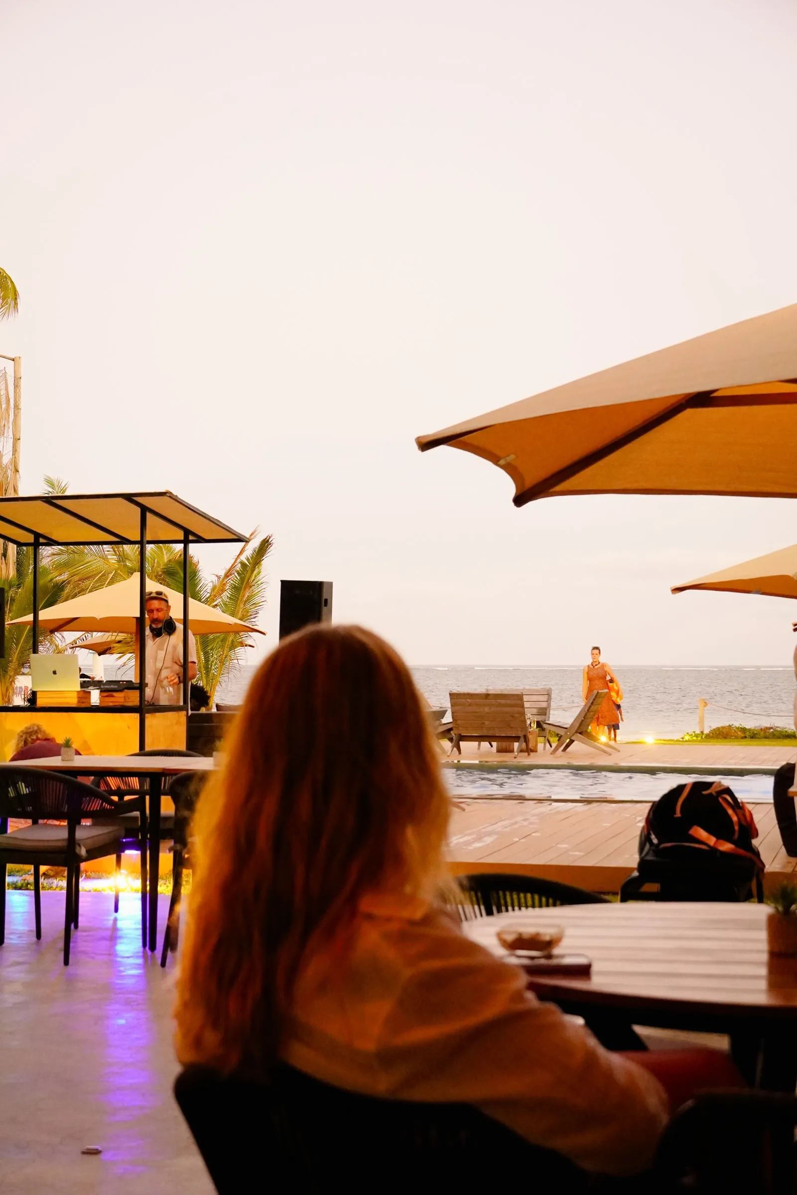 Tables at dusk, DJ lights on