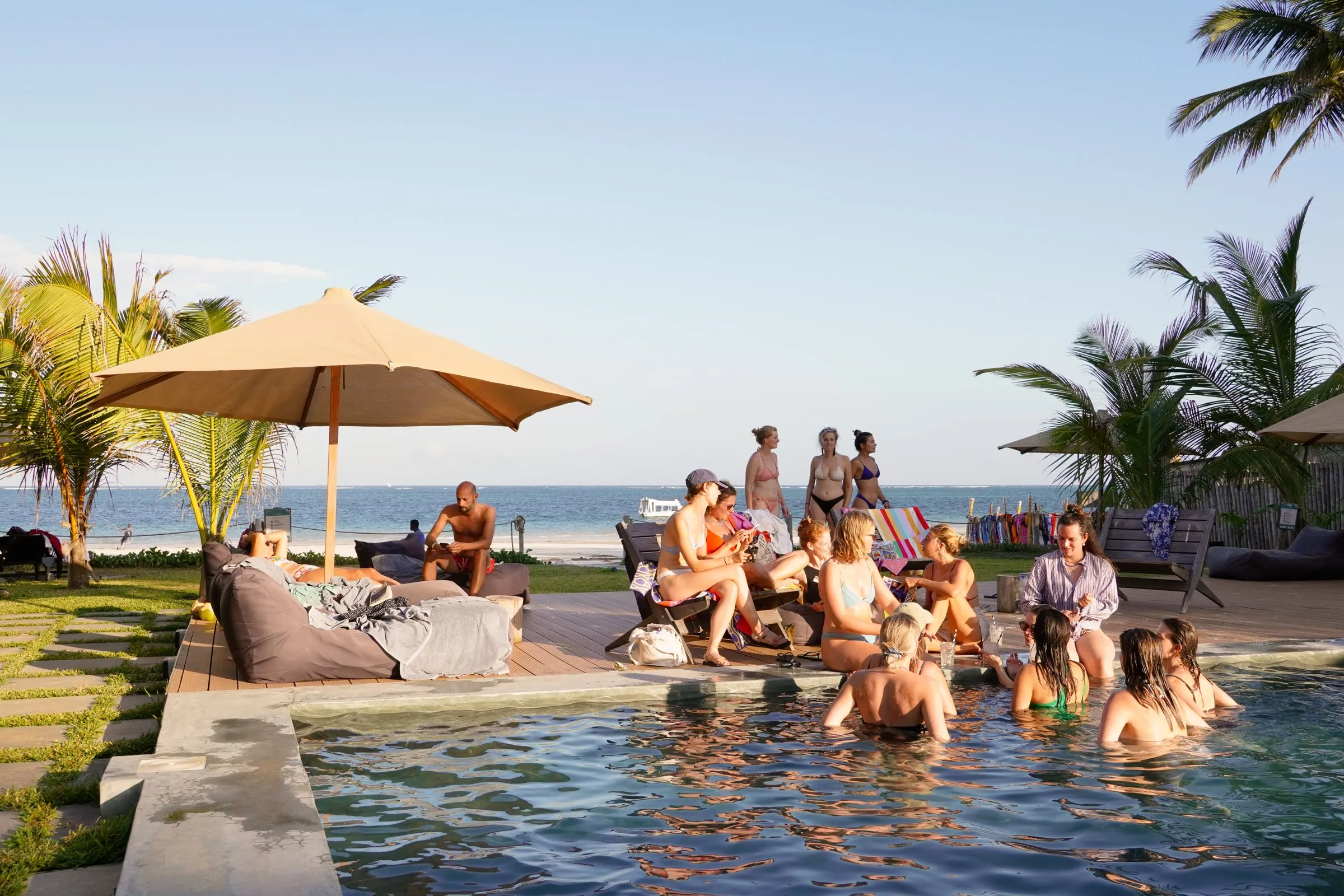 Guests in the pool at golden hour
