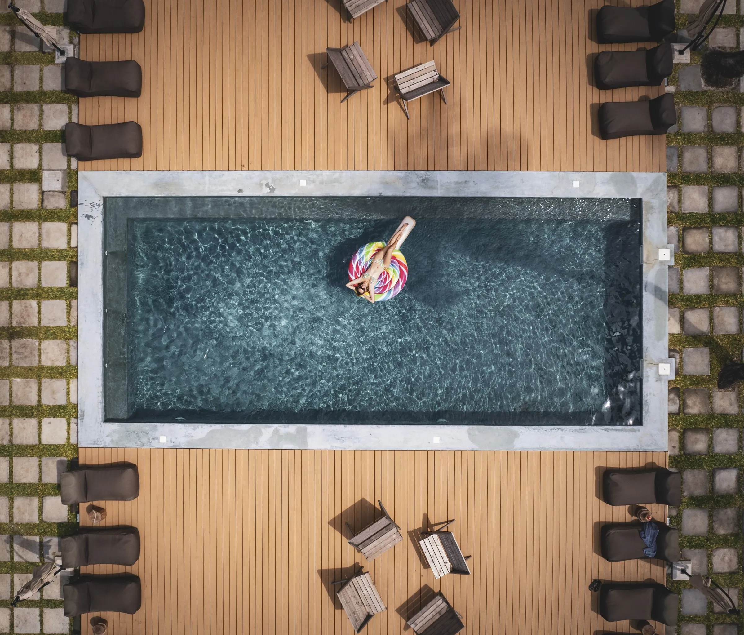 The pool from above, one guest on a float