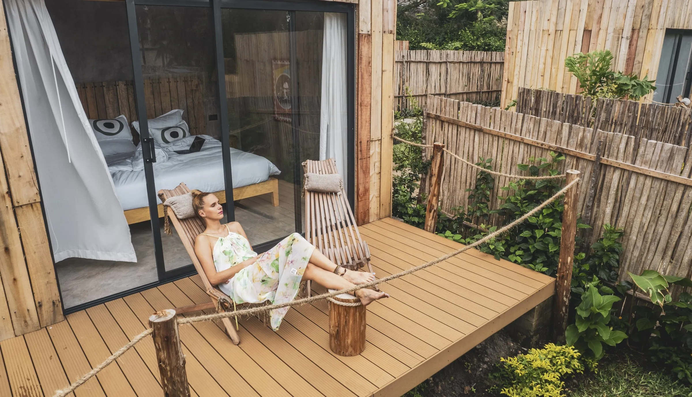 A cabin deck at LalaGalu, hammock chair and shade